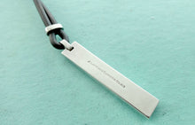 Laden Sie das Bild in den Galerie-Viewer, Authentic Tiffany & Co. Atlas Necklace Sterling Silver Black Enamel Pendant Rubber Black Cord Surfer Necklace